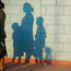 Shadows of mother with children