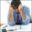 Man looks at mounting debts.