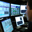 A trader looks at his monitors at the NYSE