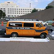 Aaron Heideman's Dodge van, with a 50-yard roll of Tyvek that contains stories of the recession.