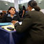 A woman is interviewed for a job