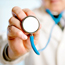 Doctor holds out stethoscope