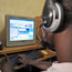 Customer uses computer in Ivory Coast cybercafe