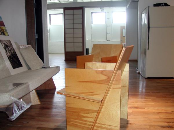 Handmade furniture adorns the waiting room of Dr. Sam Willis' clinic/studio in Northeast Minneapolis.