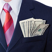 Executive with $100 bills in suit jacket pocket. 