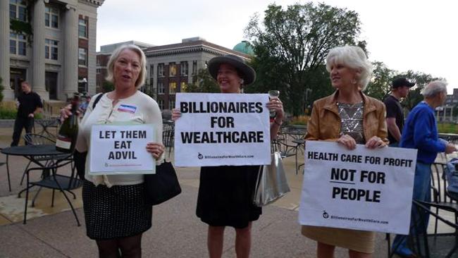 Members of Billionaires for Wealthcare, a satirical street theater group, protesting conservative opposition to health care reform at a town hall event at the University of Minnesota, Friday, Sept. 25, 2009.