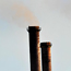 Factory exhaust stacks belch smoke