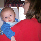 Kandy Hildenbrandt stays home with the baby while her husband works two jobs to help the family climb out of debt.