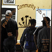 Unemployed workers register at employment center 