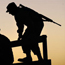 Silhouette of a U.S. soldier boarding truck