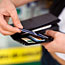 Person pulls card from wallet