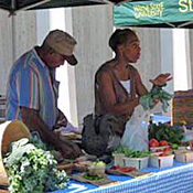 Cornelius Williams and his partner Leslie Huffman at a Farmers Market at Wayne State University.