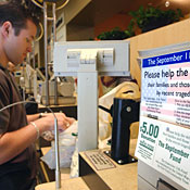 Charity coupons in a check-out line 
