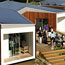 Visitors tour a solar-powered house