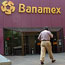 A man enters a Banamex building in Mexico City.