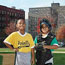 Kids pose on a baseball field