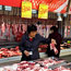 A Chinese customer buys pork