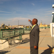 Philip Washington, head of Denver's transit system, looks onto the acreage where they plan to build more trains and stations.