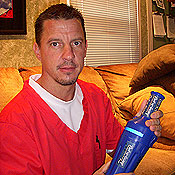 Veterinarian Mike Thomann shows off his "Port-a-Scoop" invention.