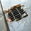 A partly blocked drain after a storm