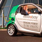 Elektromotive Managing Director Calvey Taylor-Haw in a promotional photo for the company's Elektrobay electric charging post.