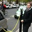 Emily Furzer with electric car at plug-in station