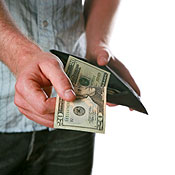 Man grabs cash from his wallet 