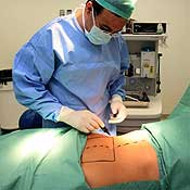 A plastic surgeon prepares for surgery 