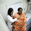 A woman is examined by a doctor