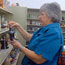 A customer looks at knickknacs in a thrift store