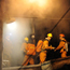 Rescue workers enter a mine shaft in China