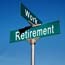 Work, Retirement crossroads sign.