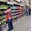 Home Depot employee checks a shelf