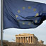 The EU flag waves above the Parthenon