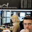 Stock brokers trade at Frankfurt's stock exchange