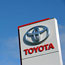 A Toyota logo pictures outside a dealership