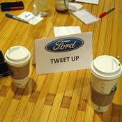 A sign on the table of a Ford Motor Co. tweetup 