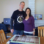 Kelly Frambach and her husband, Andy, inside their new home, looking at carpet samples.