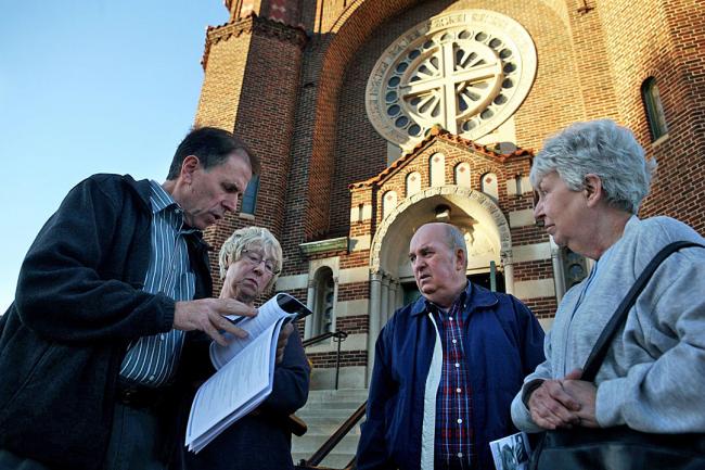 Photo Parishioners of St Andrew's Catholic Church in St Paul look over