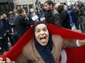 Protester with Tunisian flag in Tunis