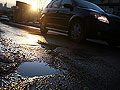 Pothole filled road