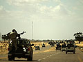 Libyan rebels retreat with their injured