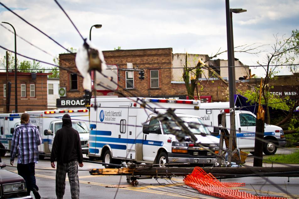 Residents of north Minneapolis survey the damage caused by a tornado ...