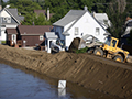 Reinforcing levee in Minot