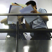 Graduates look for jobs at a job fair 