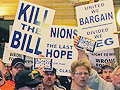 Protesters gather outside a hearing room