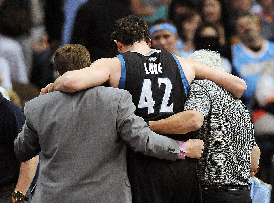 Kevin Love is helped off the court
