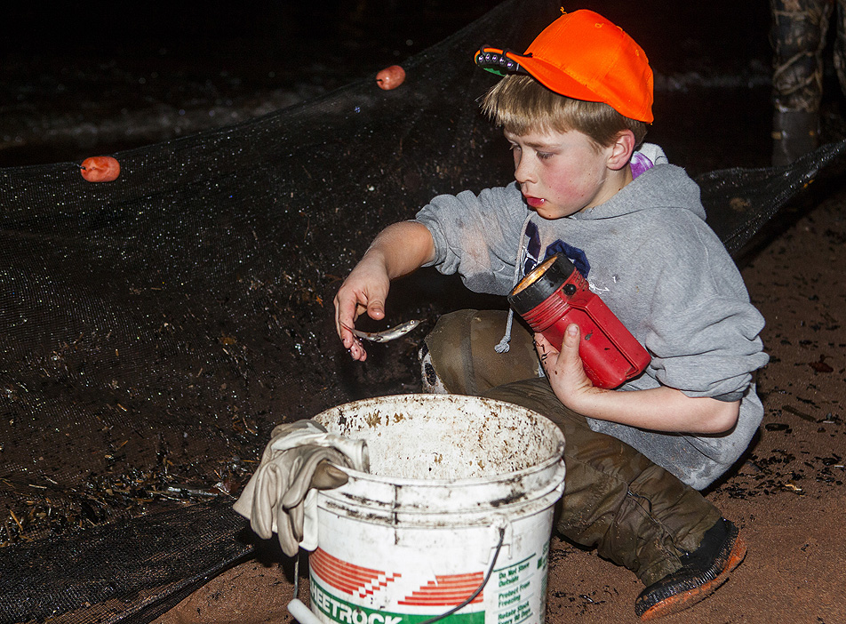 Brock House with a bucket of smelt