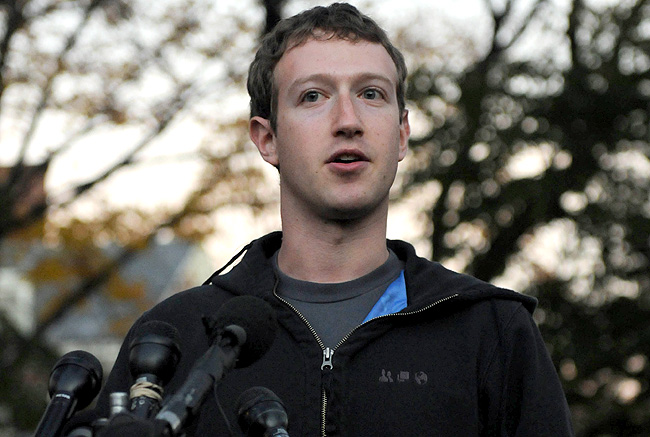 In this 2011 file photograph, Facebook founder Mark Zuckerberg speaks to reporters at Harvard University during a recruiting visit. In this 2011 file photograph, Facebook founder Mark Zuckerberg speaks to reporters at Harvard University during a recruiting visit.