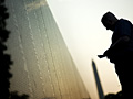 A man visits the Vietnam Memorial Wall M